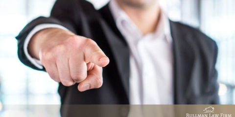 Man pointing a finger at the camera